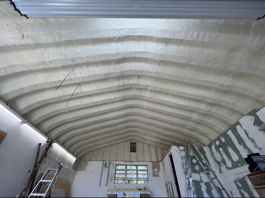 Spray polyurethane foam applied to the underside of a metal roof deck in Southborough